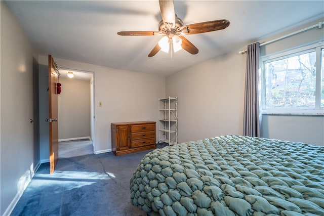 bedroom featuring dark colored carpet and ceiling fan