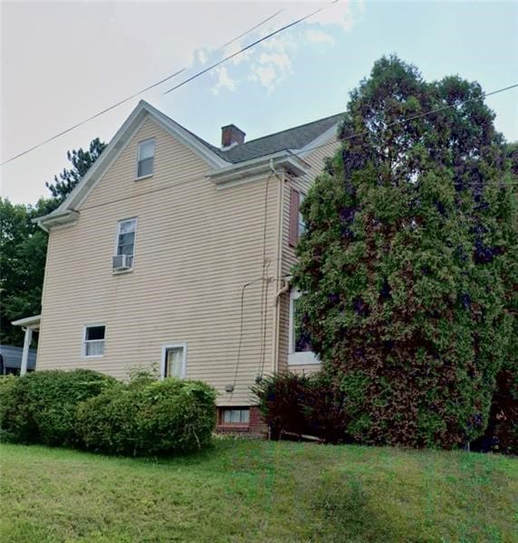 view of home's exterior featuring a lawn