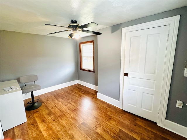 interior space featuring hardwood / wood-style flooring and ceiling fan