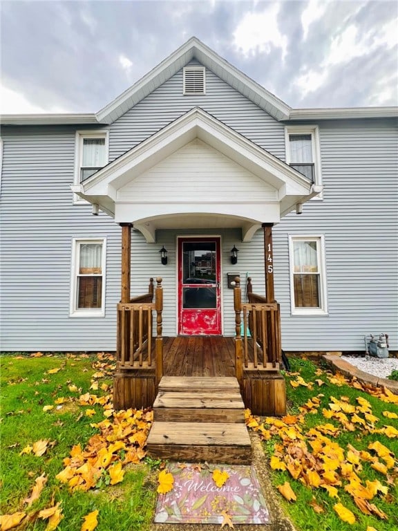 view of exterior entry with a porch