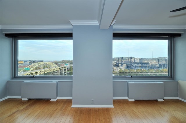 details with hardwood / wood-style flooring, beamed ceiling, and crown molding