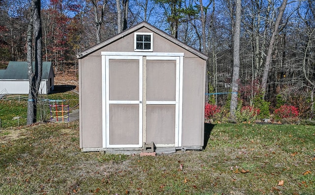 view of outbuilding with a lawn