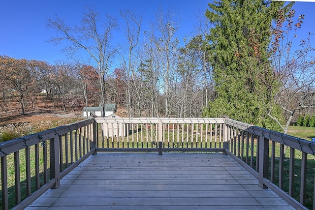 wooden terrace featuring a storage shed