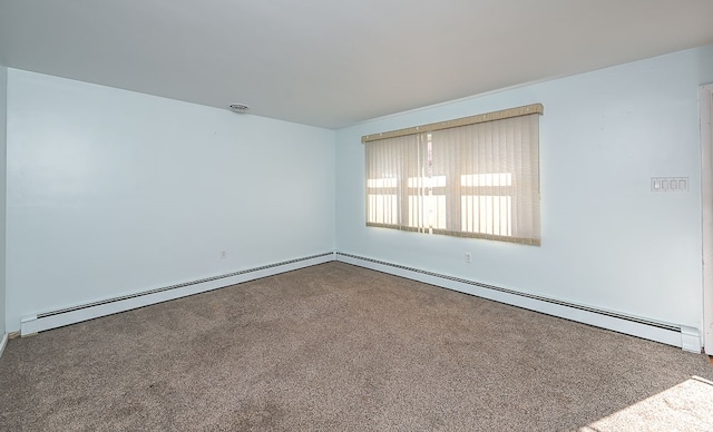 carpeted spare room featuring baseboard heating