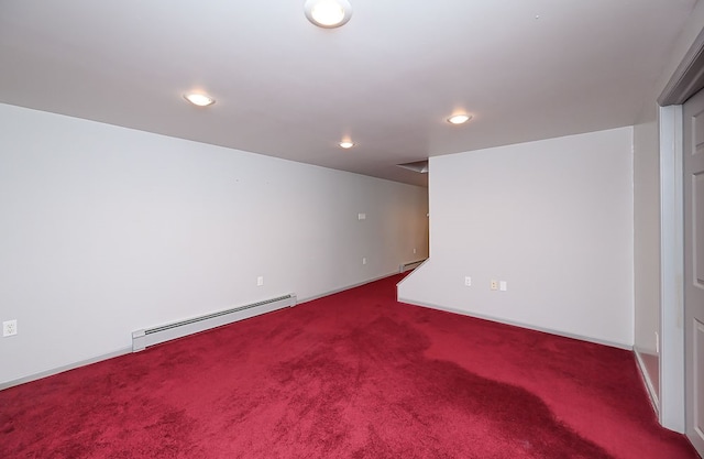 basement with baseboard heating and carpet