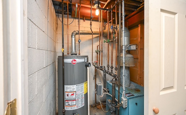 utility room featuring gas water heater