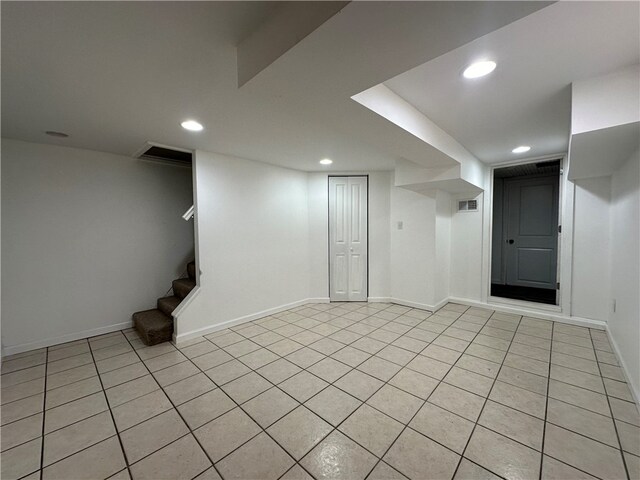 basement with light tile patterned floors