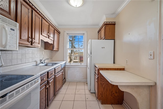 kitchen with sink, ornamental molding, light tile patterned flooring, backsplash, and white appliances