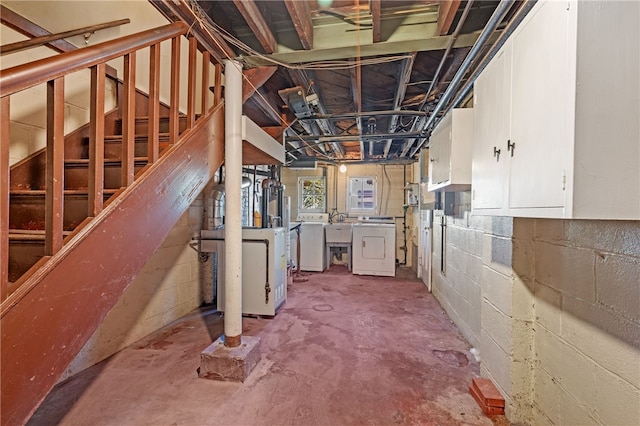 basement with sink and washer / dryer