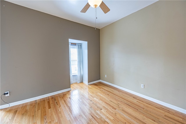 spare room featuring ceiling fan and light hardwood / wood-style floors