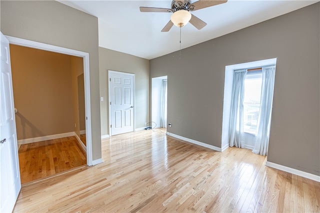 unfurnished room with ceiling fan and light hardwood / wood-style floors