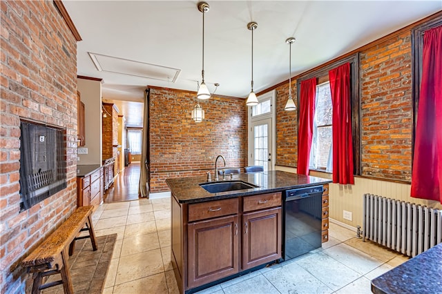 kitchen featuring radiator, black dishwasher, sink, pendant lighting, and brick wall