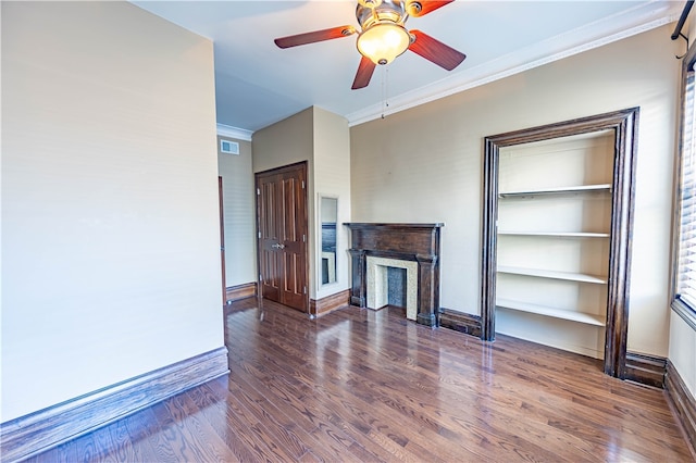 living room featuring dark wood-type flooring, ceiling fan, and ornamental molding