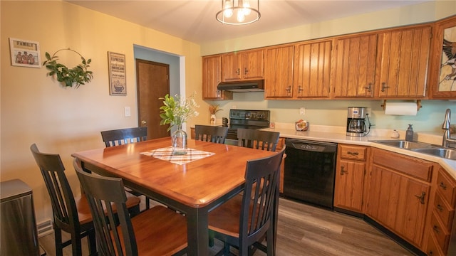 kitchen featuring hardwood / wood-style floors, sink, and black appliances