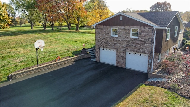 view of side of home with a garage and a lawn