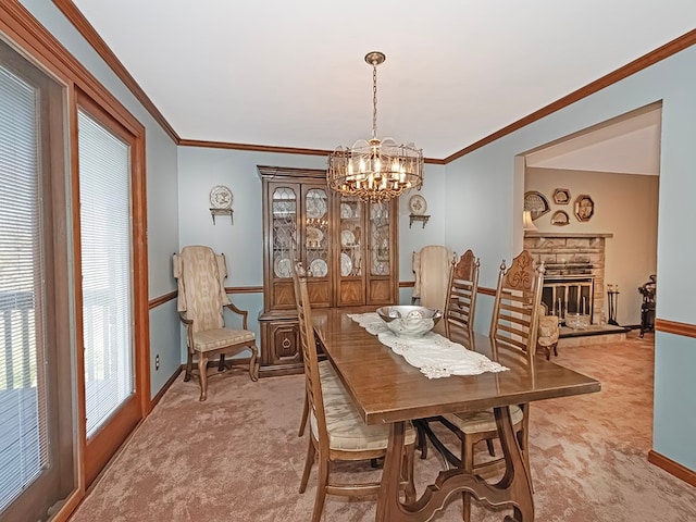 carpeted dining area featuring a stone fireplace, a notable chandelier, and crown molding