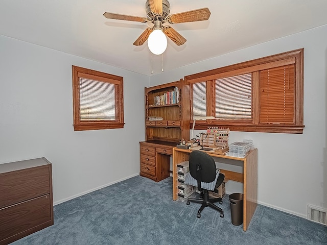 carpeted office with ceiling fan