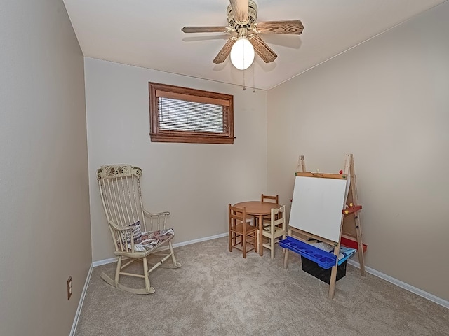 sitting room with light carpet and ceiling fan