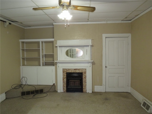 unfurnished living room featuring carpet and ceiling fan