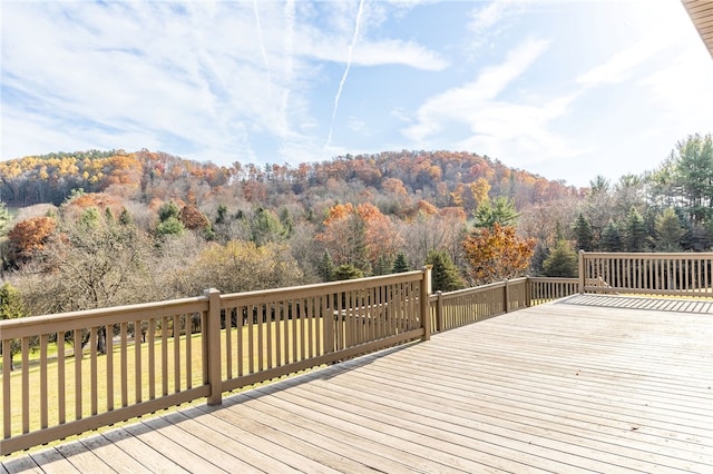 wooden deck featuring a yard