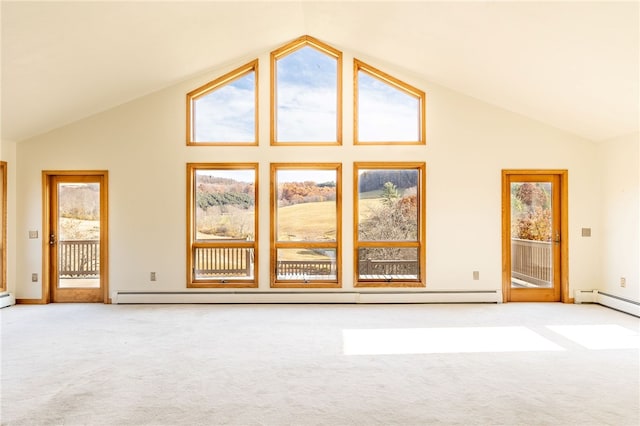 unfurnished living room featuring a wealth of natural light, light colored carpet, and high vaulted ceiling