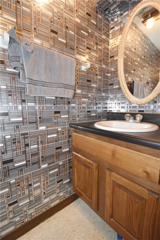 bathroom with decorative backsplash and vanity