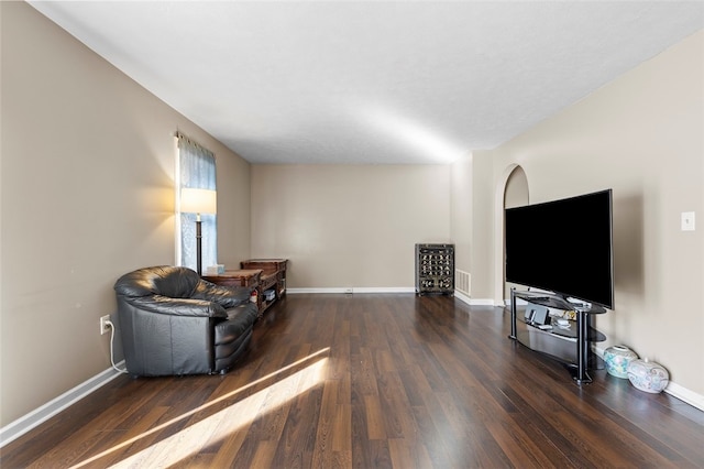 sitting room featuring dark hardwood / wood-style flooring