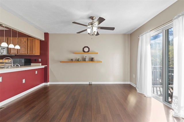 kitchen featuring dark wood-type flooring and ceiling fan