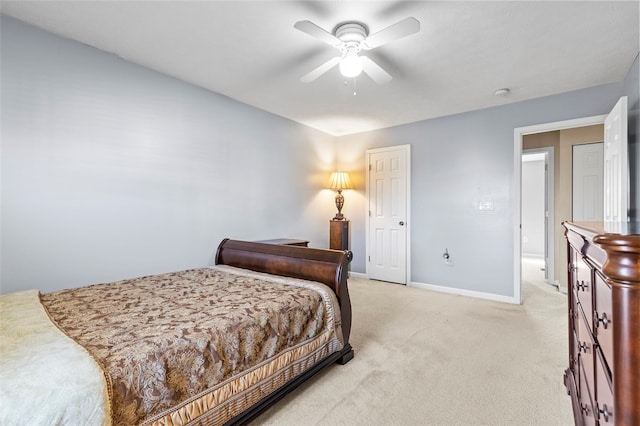 bedroom featuring light colored carpet and ceiling fan