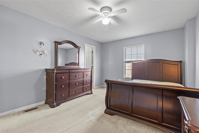 bedroom with ceiling fan and light colored carpet