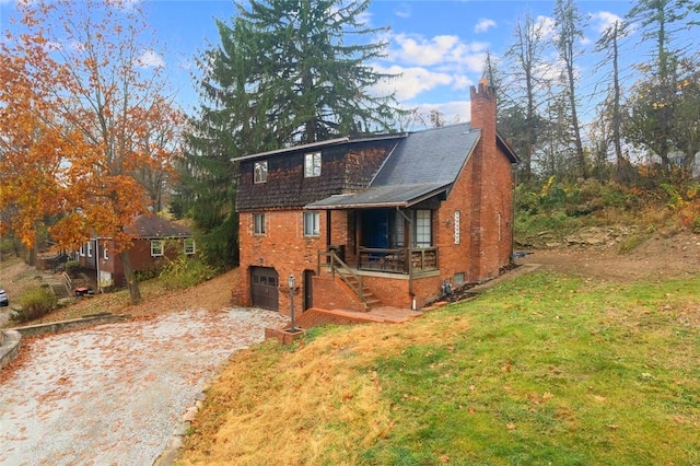 view of front of house featuring a garage and a front lawn