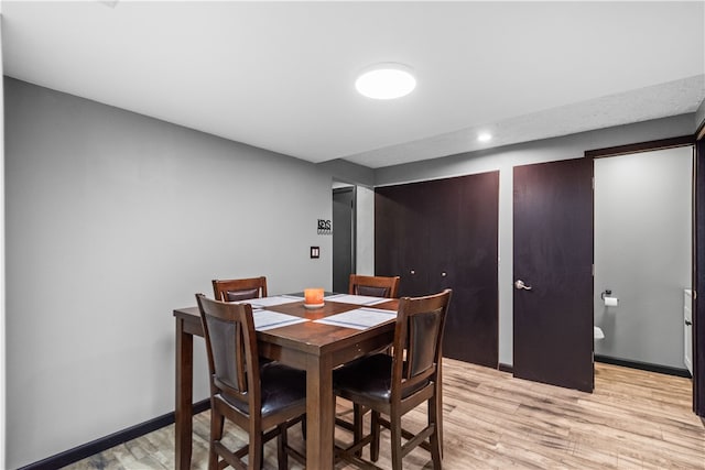 dining space featuring light wood-type flooring