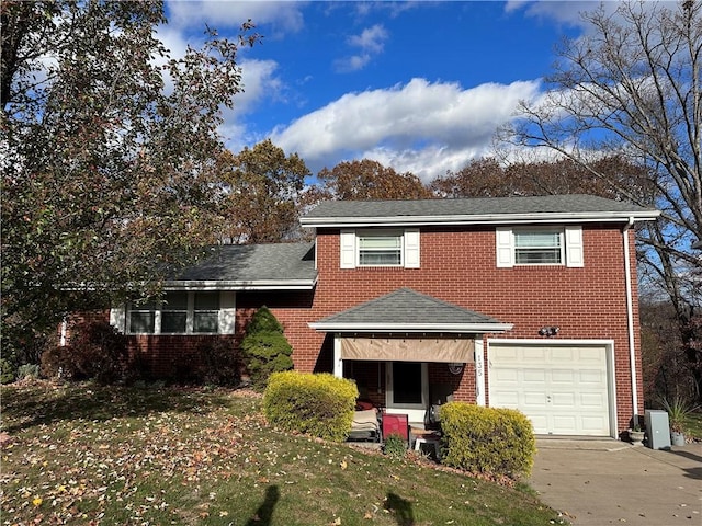 view of front of home with a garage and a front lawn