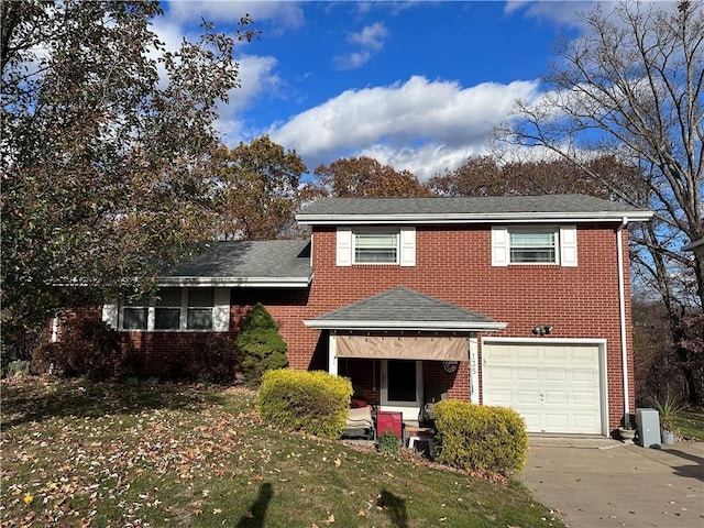 view of front of house featuring a front yard and a garage