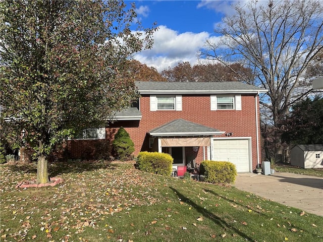 view of front property featuring a front lawn and a garage