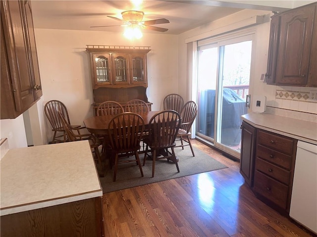 dining room featuring dark hardwood / wood-style flooring and ceiling fan