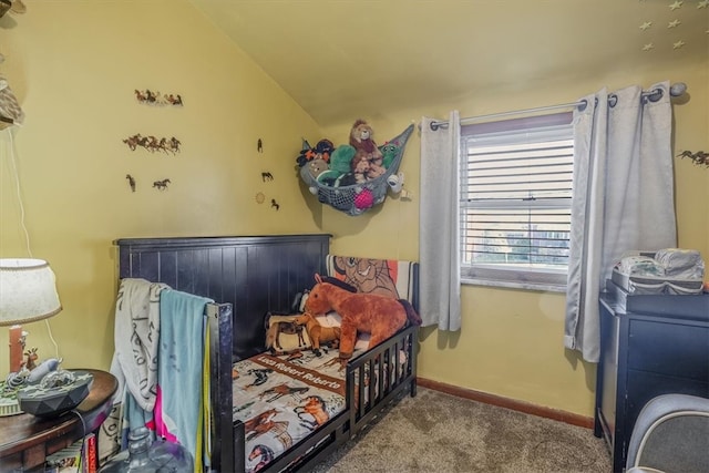 bedroom featuring lofted ceiling and carpet flooring