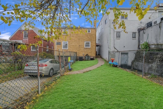 rear view of property featuring a yard