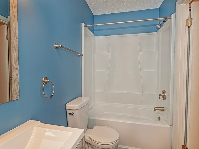 bathroom with a textured ceiling, toilet, and shower / bathtub combination