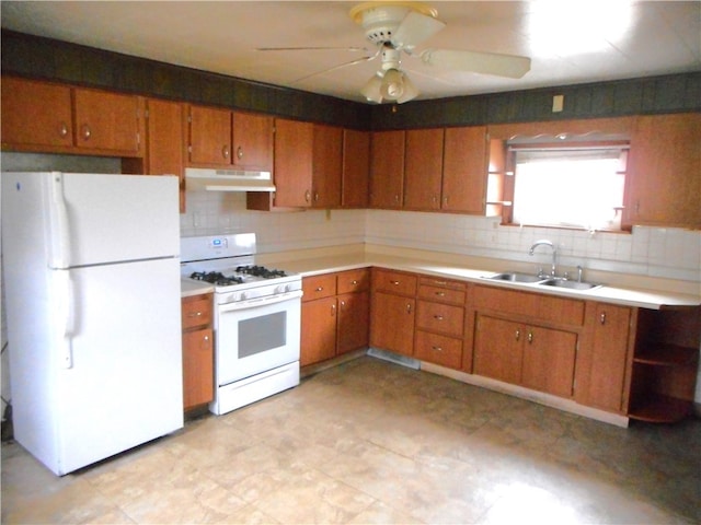 kitchen featuring tasteful backsplash, sink, white appliances, and ceiling fan