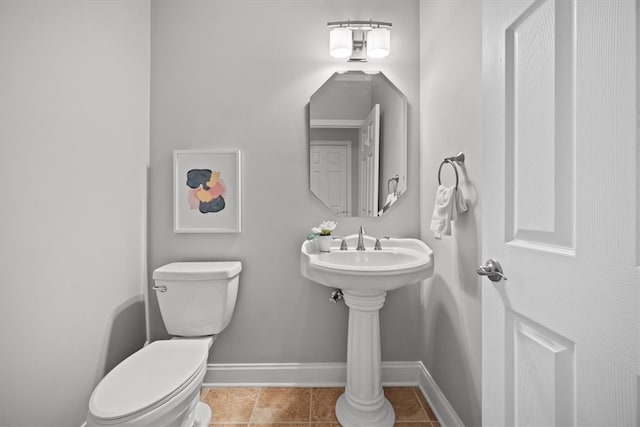 bathroom with tile patterned flooring and toilet