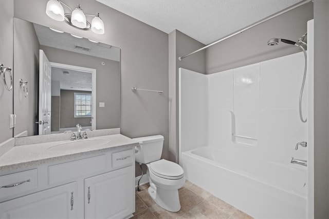 full bathroom featuring tub / shower combination, a textured ceiling, vanity, tile patterned floors, and toilet