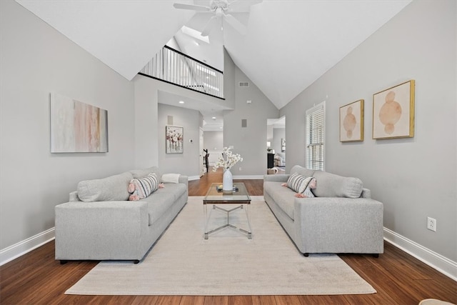 living room with high vaulted ceiling, dark hardwood / wood-style flooring, and ceiling fan