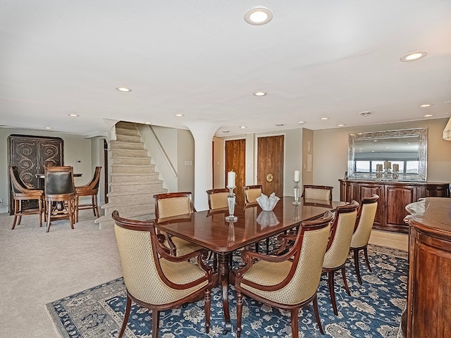 dining area featuring light colored carpet