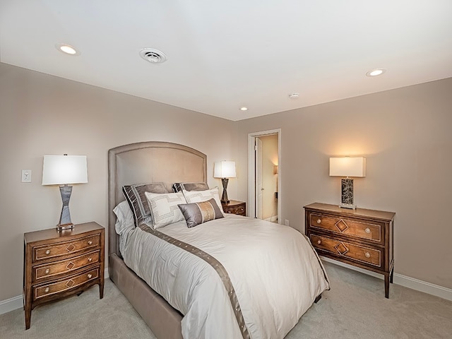 bedroom with light carpet