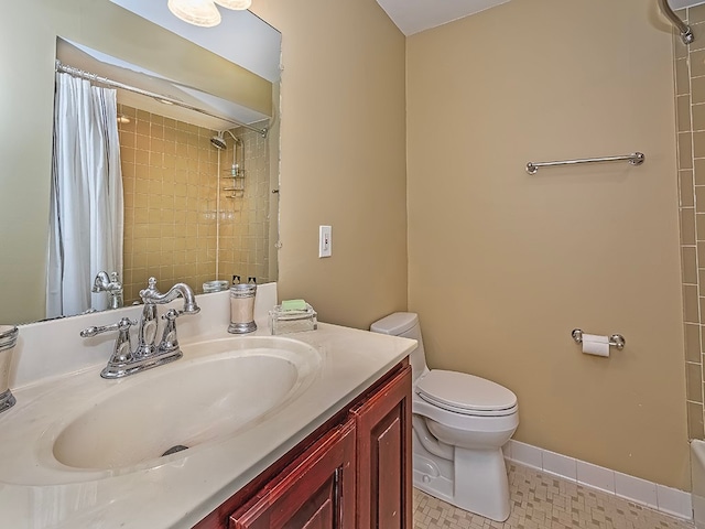 bathroom featuring vanity, toilet, and a shower with curtain