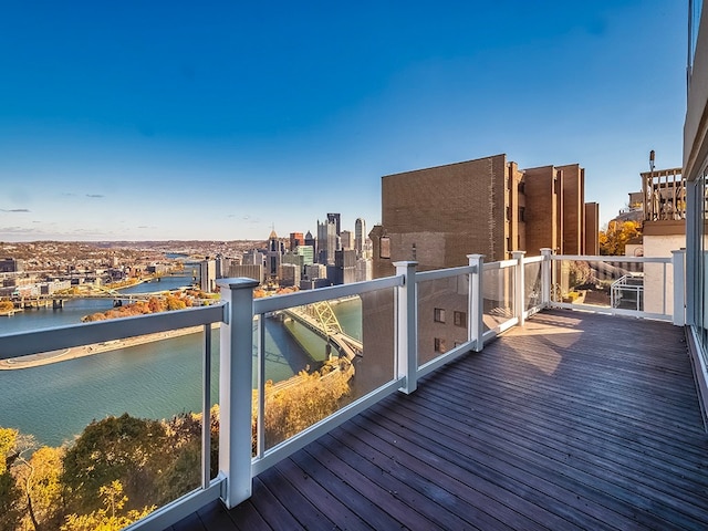 wooden deck with a water view