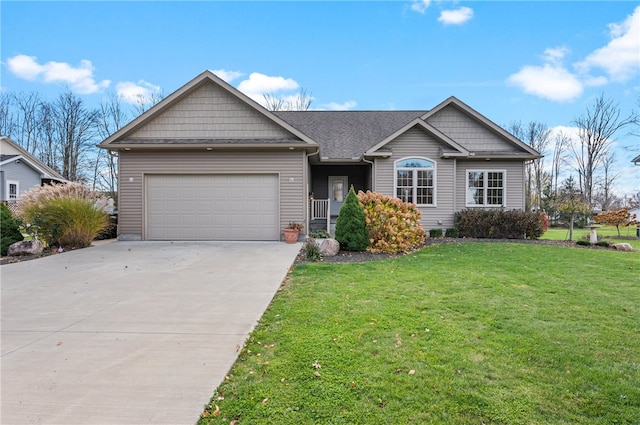 view of front of property featuring a garage and a front lawn