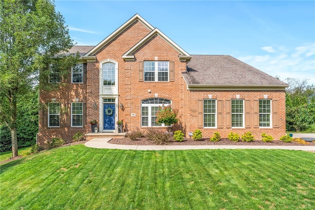 view of front of property with a front lawn