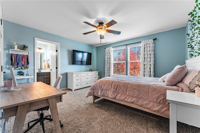 carpeted bedroom featuring ensuite bathroom and ceiling fan